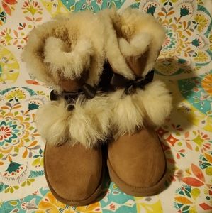 NWOT.. UGG boots with fur balls and bows.